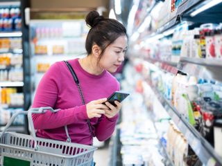 Asian woman shopping in supermarket