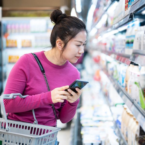 Asian woman shopping in supermarket
